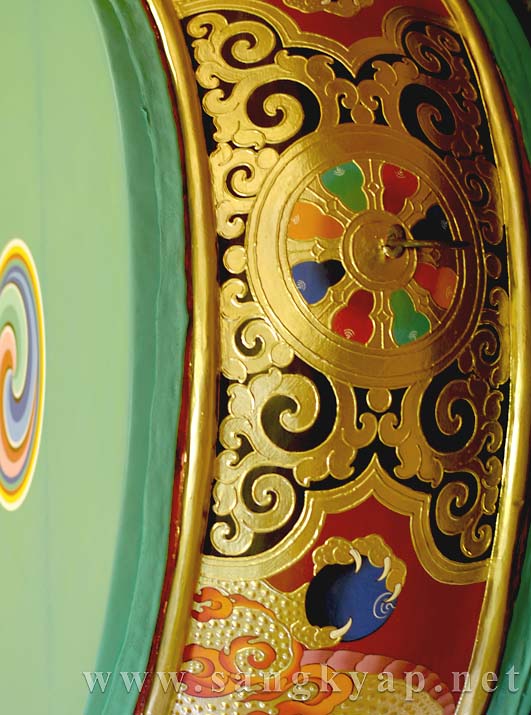 The Wheel of Dharma on top