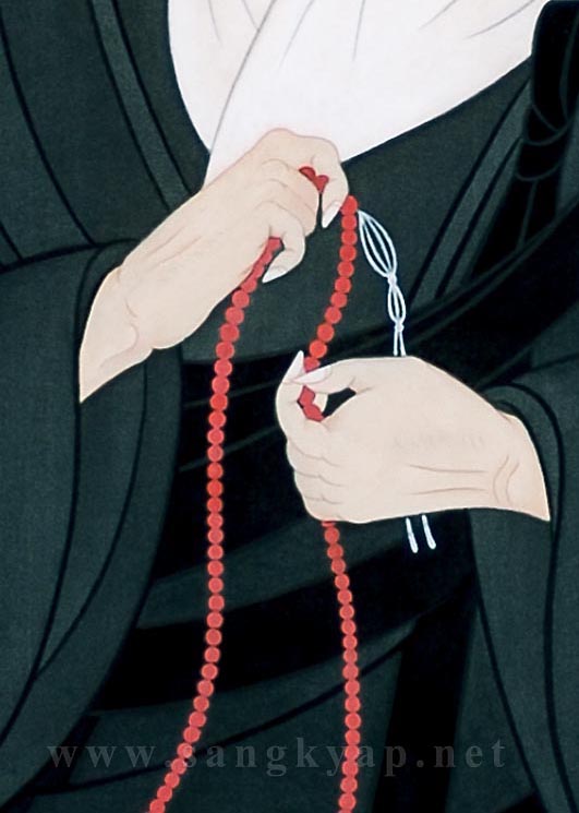 Holding a rosary in his hands